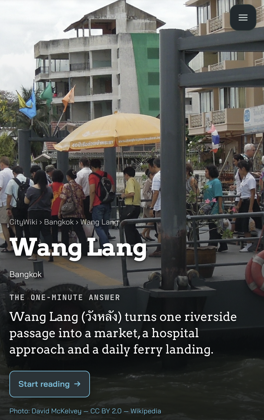 CityWiki Wang Lang page example with people at the riverside landing and a concise place introduction